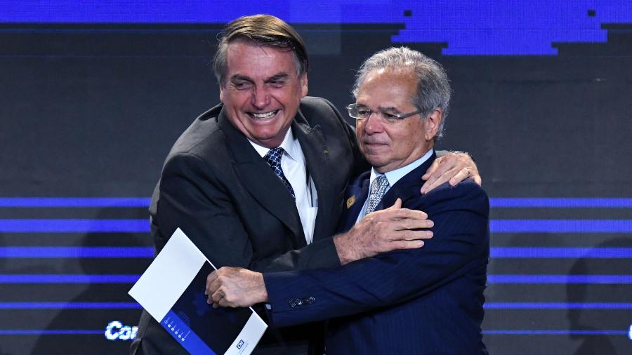 BRASILIA, DF, 7-12-2021 - O presidente Jair Bolsonaro ao lado de Paulo Guedes, ministro da economia, durante o encontro com Empresários da Indústria Brasileira. | Imagem: Edu Andrade/Divulgação