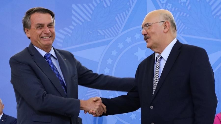 O presidente Jair Bolsonaro e o ex-ministro da Educação Milton Ribeiro em cerimônia em fevereiro de 2022 | Imagem: Clauber Cleber Caetano/Presidência da República